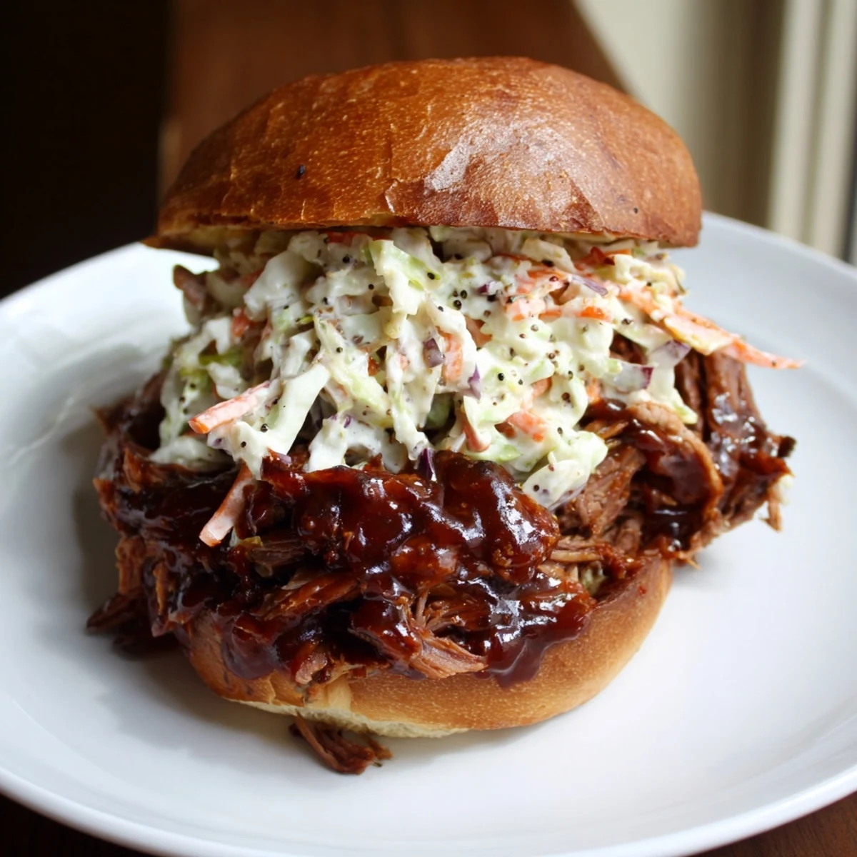 A hearty Slow Roasted Pulled Beef Sandwich with smoky aroma, perfect for a family meal.