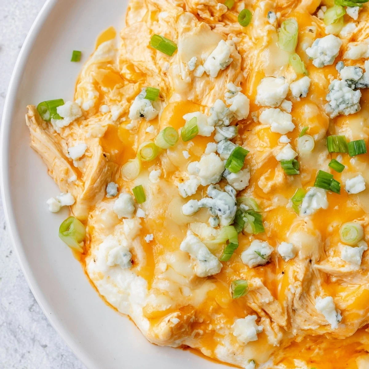 A warm and bubbly Keto Buffalo Chicken Dip fresh from the oven, showcasing a creamy texture and melted cheese. 