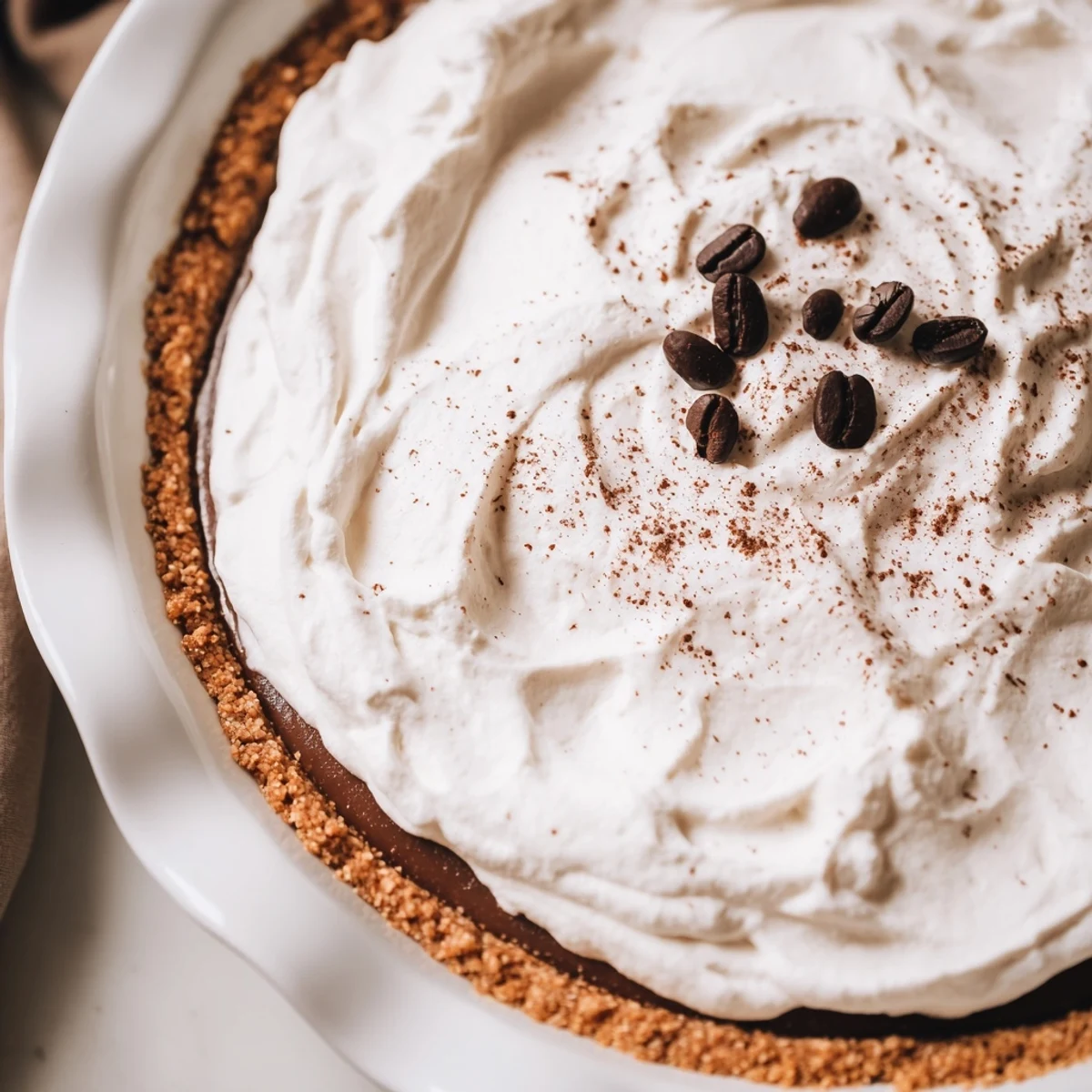 Cold brew coffee pie on a rustic table, showing smooth filling texture and keto-friendly ingredients, served chilled for coffee dessert lovers.