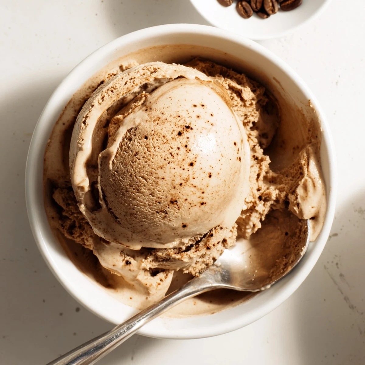 Close-up of Vietnamese Coffee Ice Cream beside a hot espresso shot, creating an indulgent affogato dessert moment.