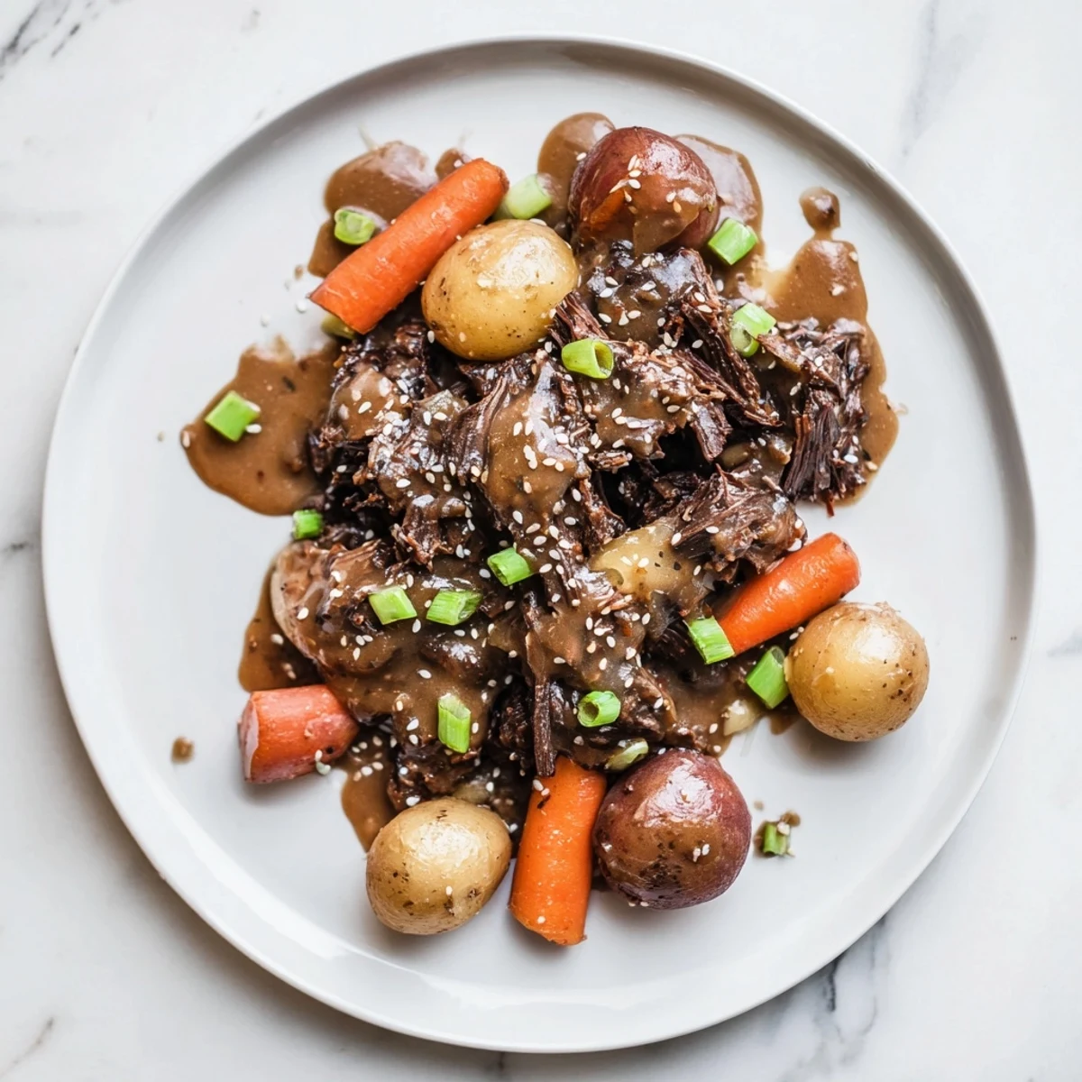 Tender Slow Cooker Korean Beef Pot Roast simmering in soy garlic gravy with onions, carrots, and baby potatoes in a slow cooker.