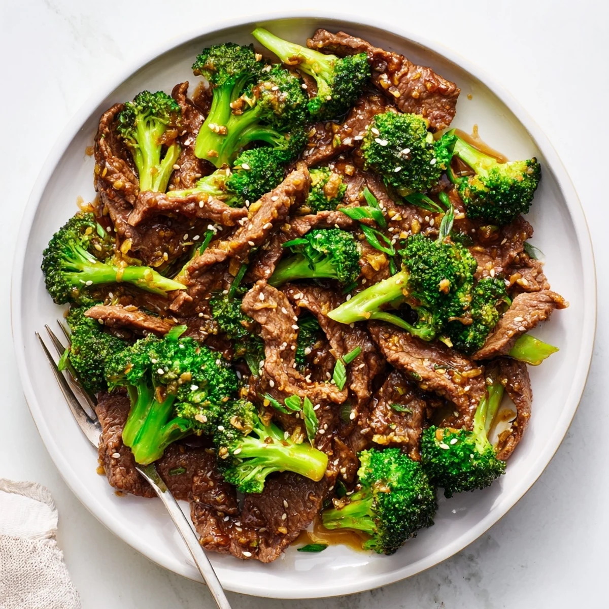 Better Than Takeout Beef With Broccoli sizzling in a wok, stir-fried with crisp broccoli and savory sauce for an easy weeknight dinner.