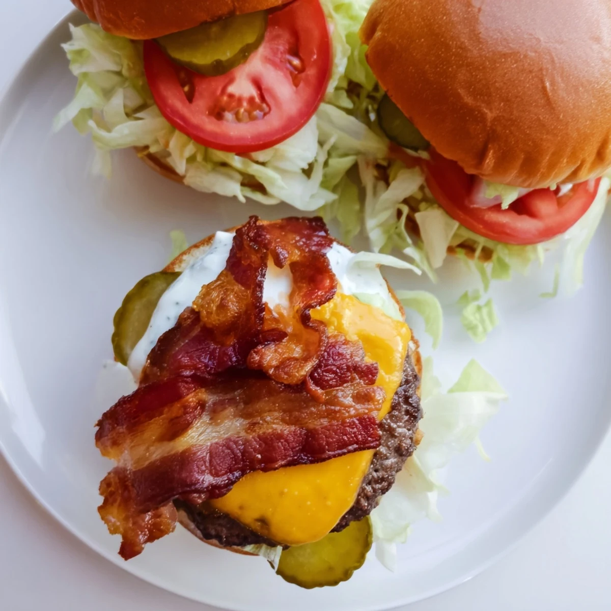 Golden Crack Burgers dripping with savory crack sauce, loaded with melted cheese and crispy bacon for the ultimate cookout