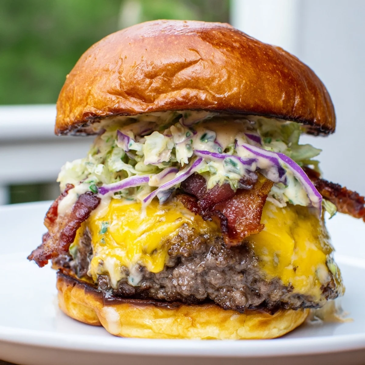 Golden toasted crack burger layered with melted cheese, crispy bacon, fresh vegetables, and signature creamy dressing