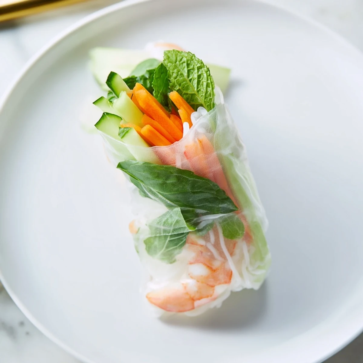 Light and refreshing Vietnamese spring rolls featuring vibrant mint, cilantro, lettuce, and tender shrimp served with rich peanut sauce