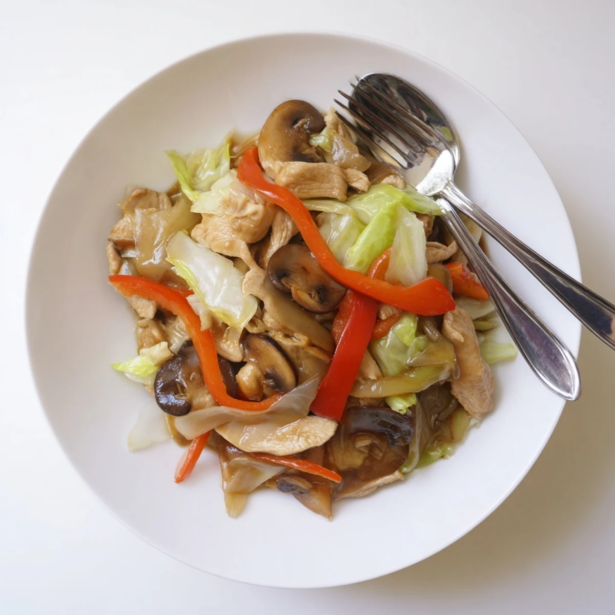 Colorful Chop Suey stir-fry with tender chicken and crisp vegetables in glossy savory sauce