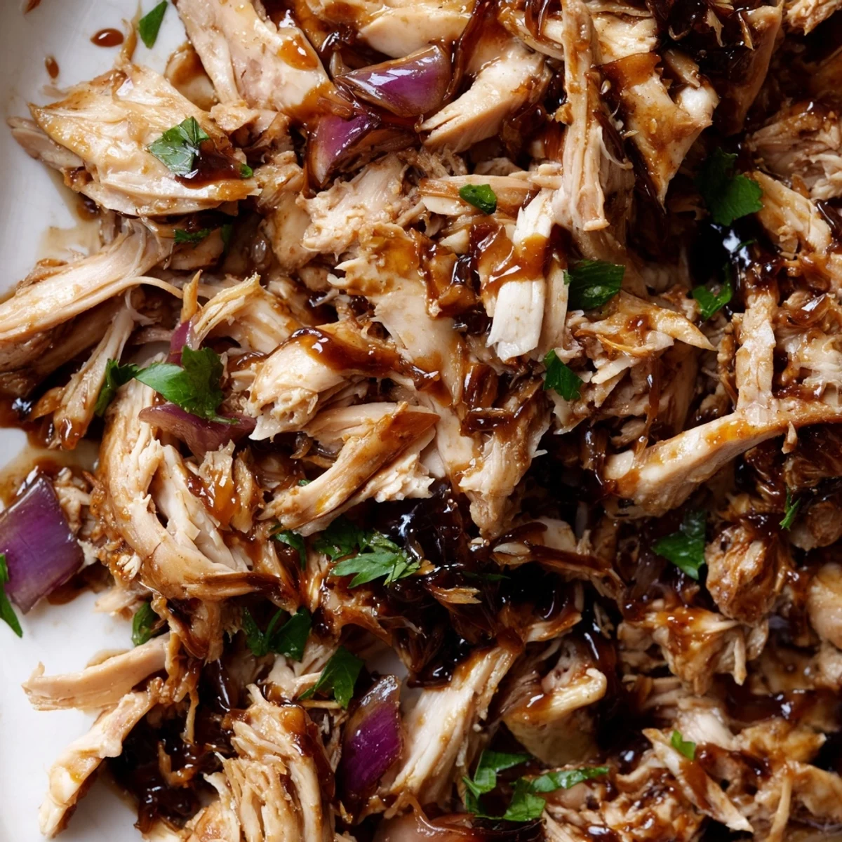 Fall-apart chicken thighs coated in sweet balsamic mixture served over fluffy white rice