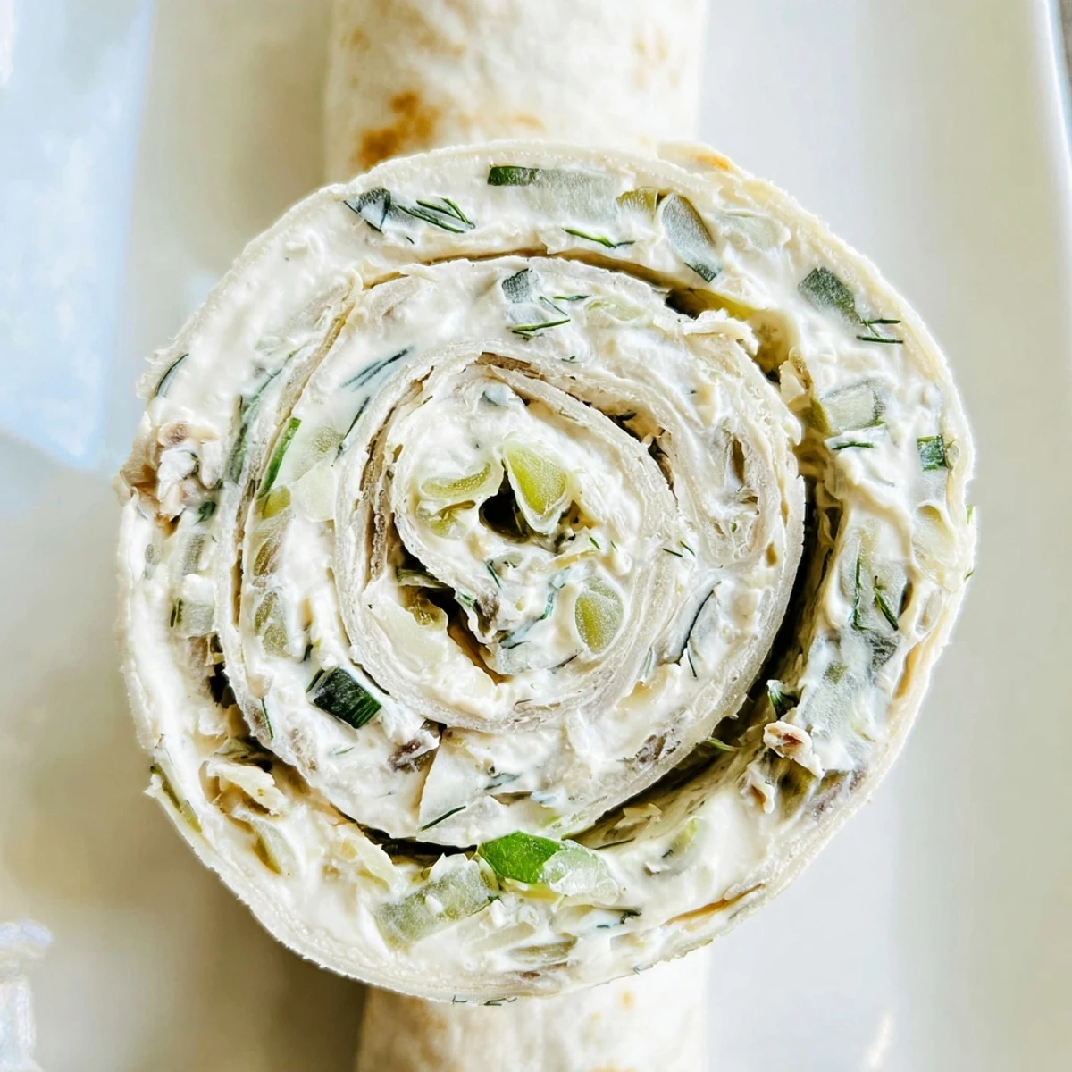 Pickle dip pinwheels featuring creamy dill filling rolled in soft flour tortillas
