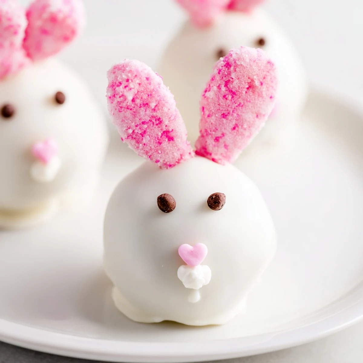 Bunny Oreo Balls coated in smooth white chocolate with marshmallow ears and pink sugar details