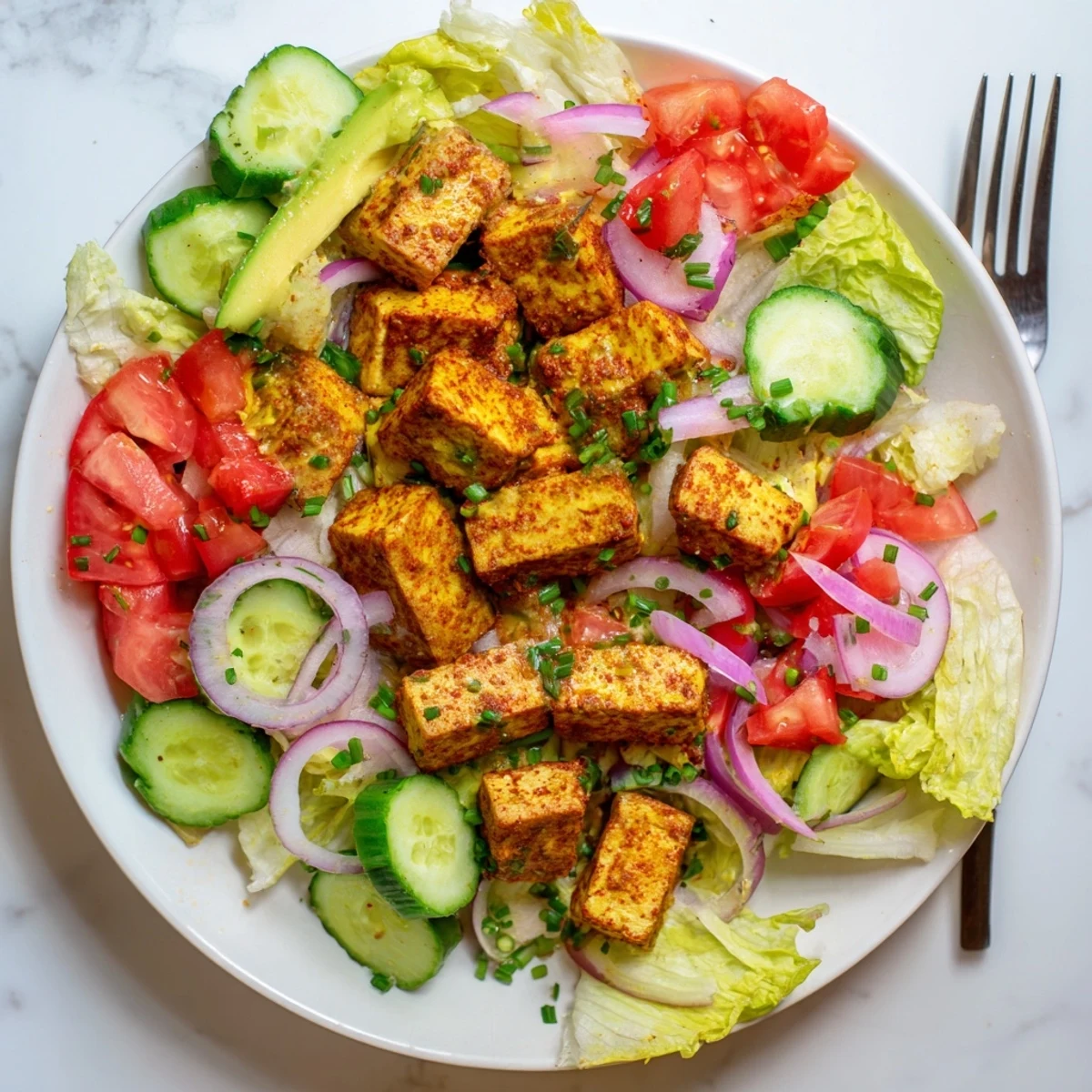 Light and refreshing summer smoky tofu lettuce tomato salad drizzled with lemon olive oil dressing