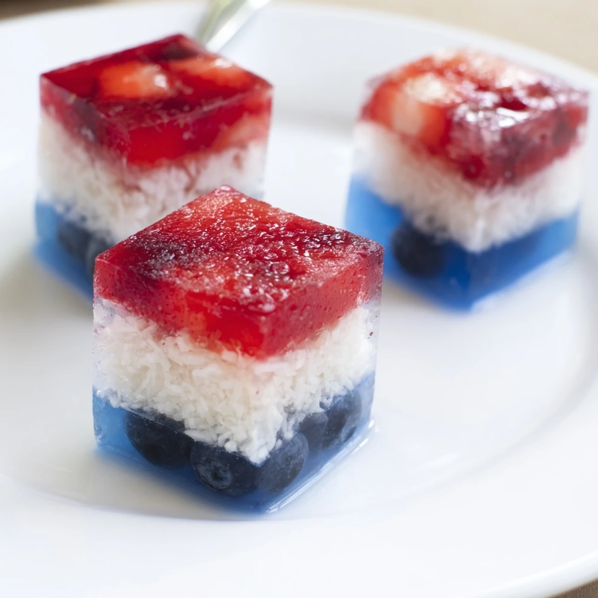 Frosty Red White And Blue Ice Cubes Recipe with vibrant strawberry, blueberry layers  