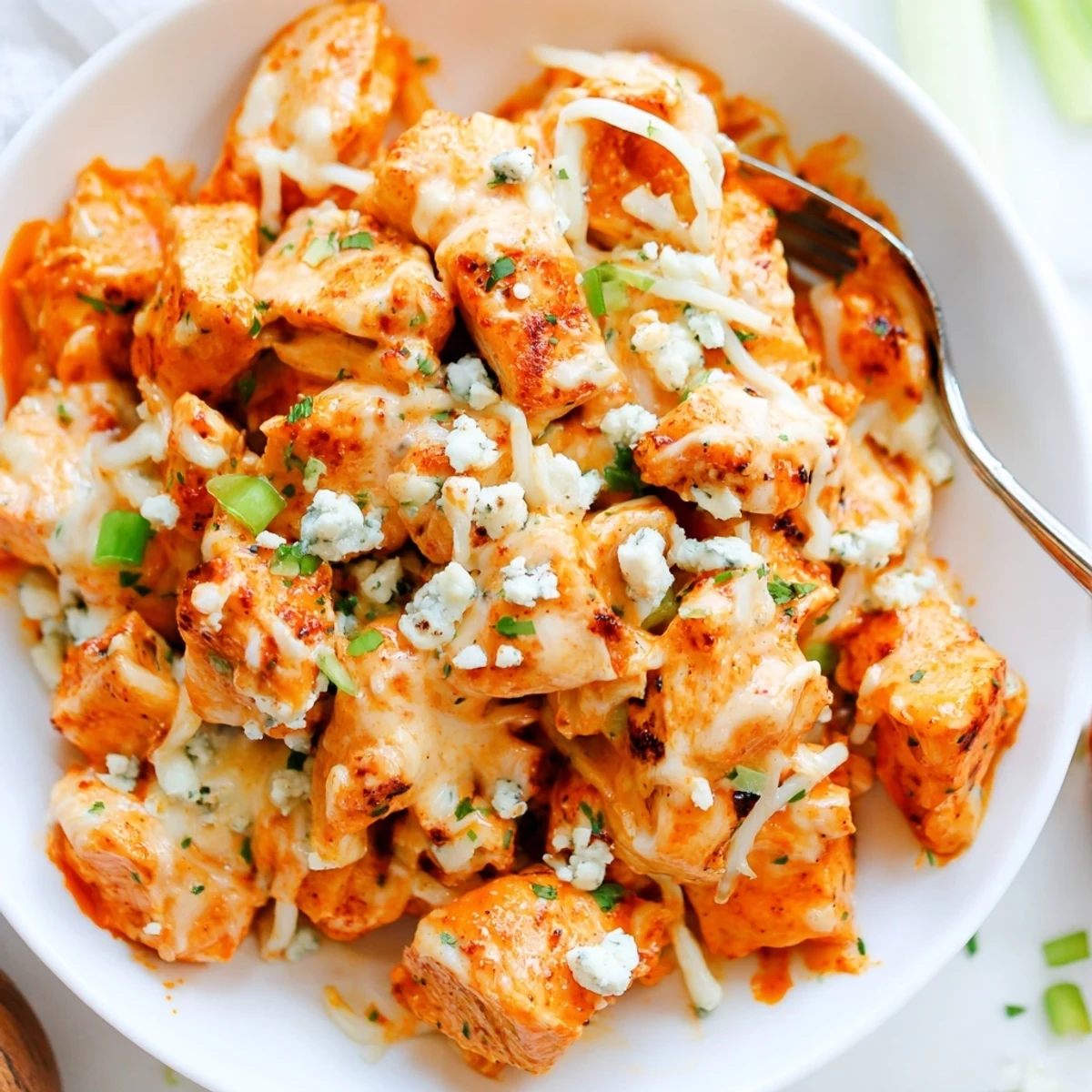 Keto Buffalo Chicken Skillet sizzling with spicy sauce, tender chicken bites.