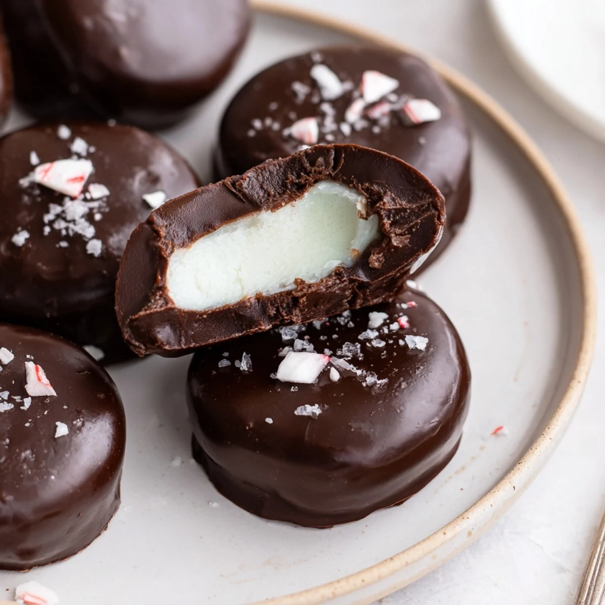 Bite-sized Peppermint Patties with silky chocolate coating and bright peppermint aroma.