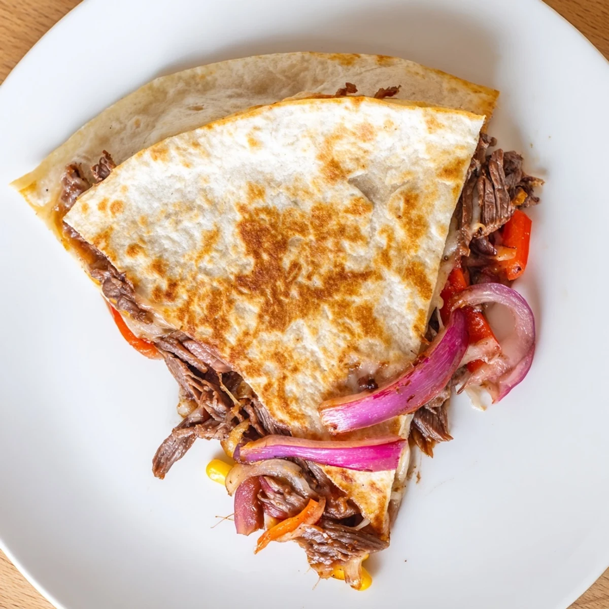 Sweet Savory Beef Quesadillas Recipe smoky beef, sweet corn, cheddar, paired with sour cream