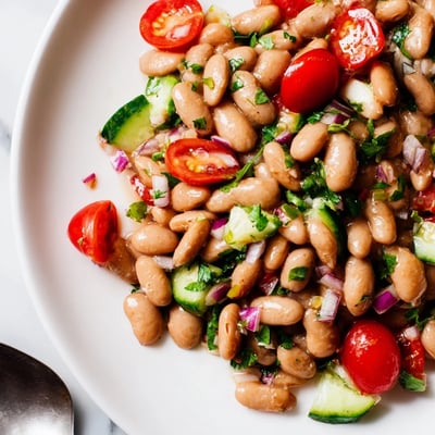 Hearty pinto bean salad tossed with diced cucumber, bell pepper, and zesty lime dressing